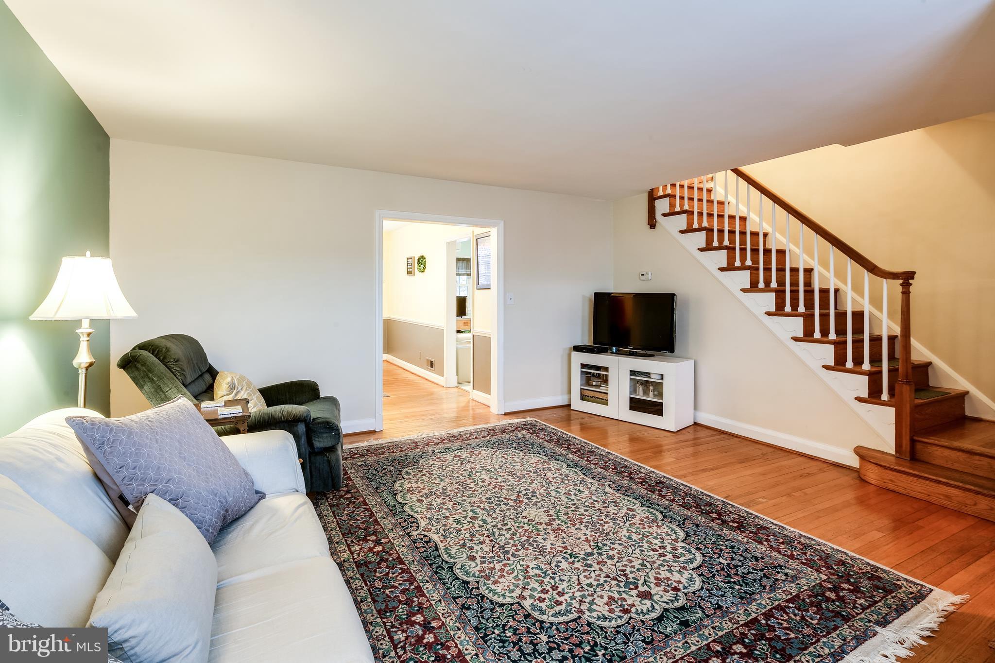 412 Greenlow Road Baltimore, MD 21228 - Photo 6 of 26 Hardwood floors continue up stairs