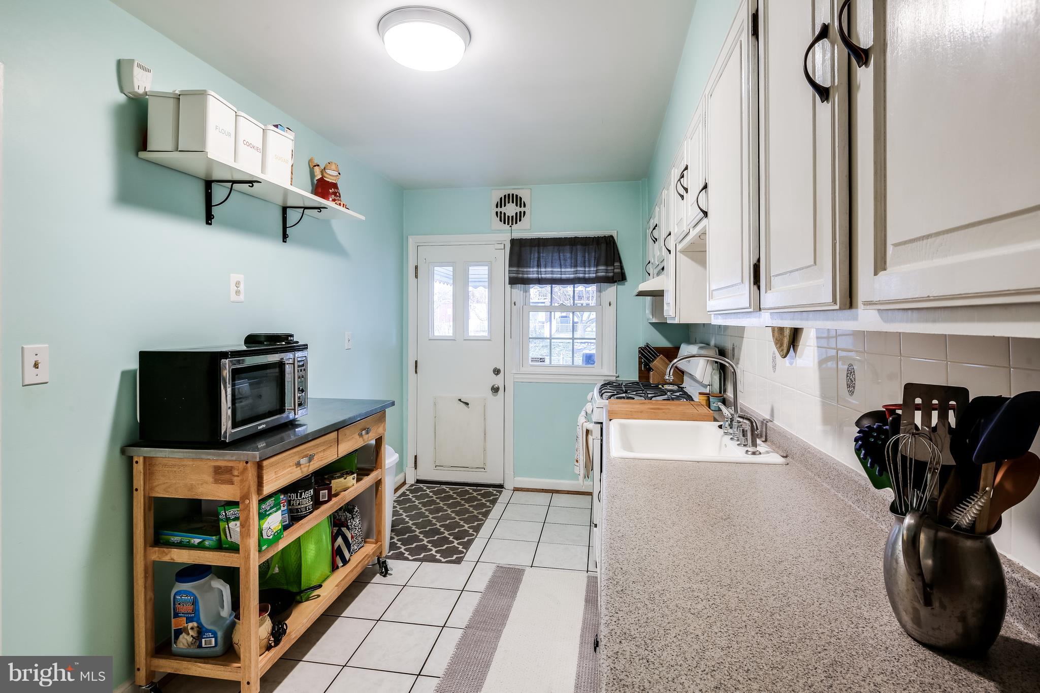 412 Greenlow Road Baltimore, MD 21228 - Photo 10 of 26 Kitchen leads to rear yard with patio