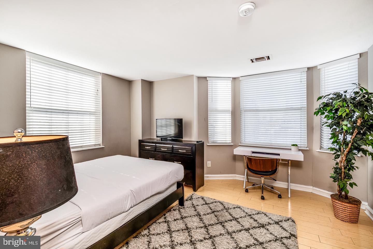 2135 Walnut Street, Unit 603 Philadelphia, PA 19103 - Photo 12 of 13 a bedroom with a bed and a window