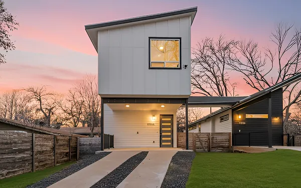 a front view of a house with garden