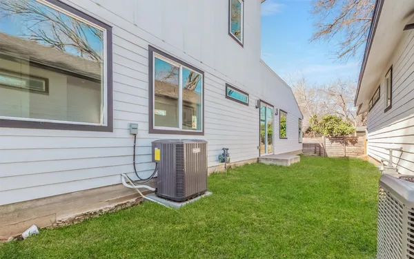 a view of a house with a backyard