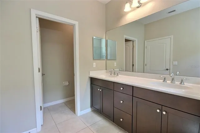 a kitchen with stainless steel appliances granite countertop a sink a stove a refrigerator and a microwave