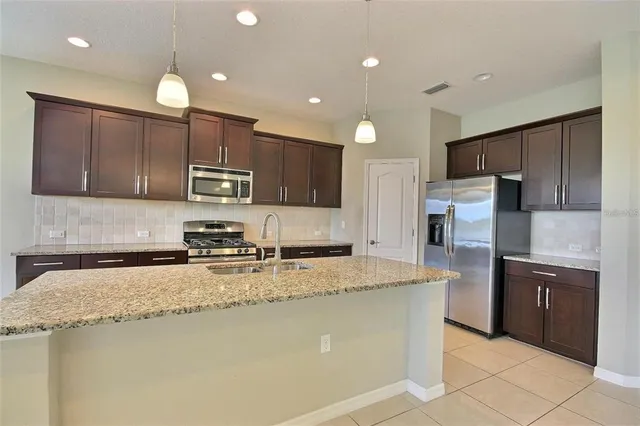 a view of a room with windows and chandelier
