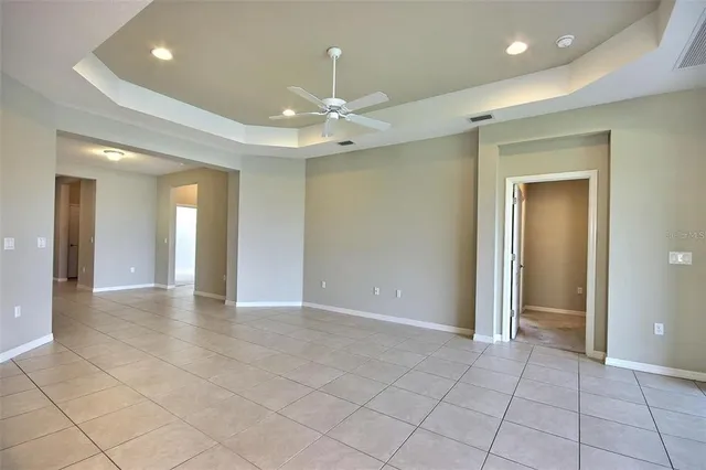 a view of a kitchen with microwave and cabinets
