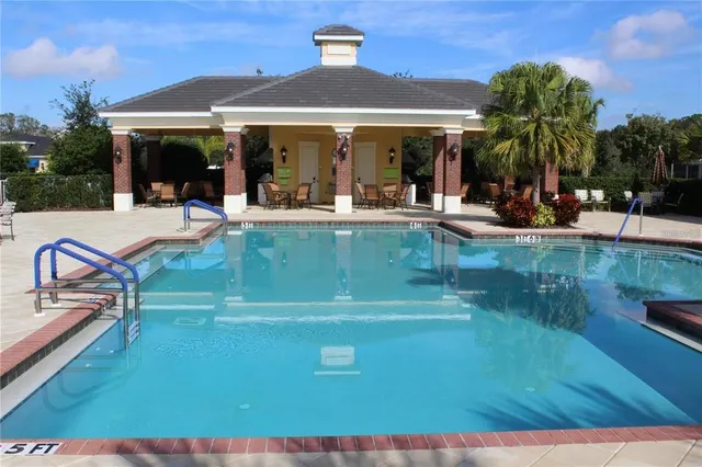 a view of a swimming pool with a patio