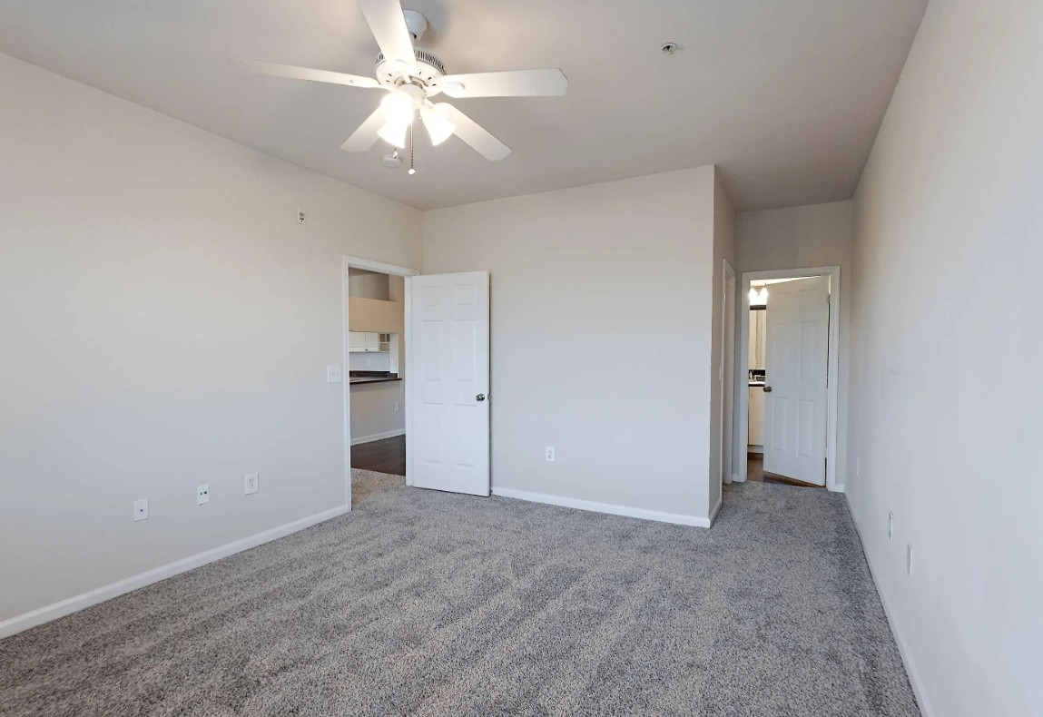 10505 South I-35 Frontage Road, Unit 1732 Austin, TX 78747 - Photo 16 of 22 a view of an empty room with a ceiling fan