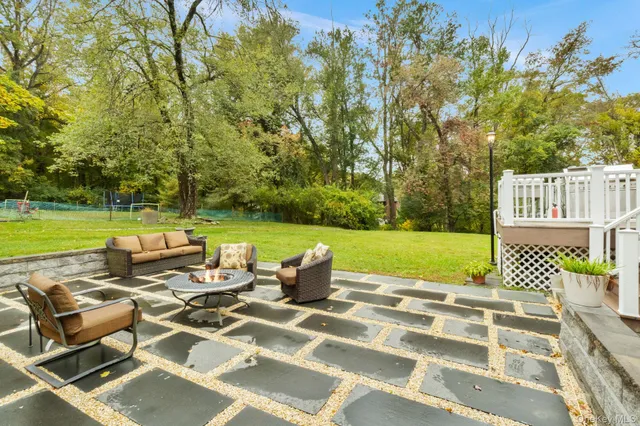 swimming pool view with a seating space