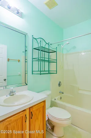 a bathroom with a toilet and a bathtub