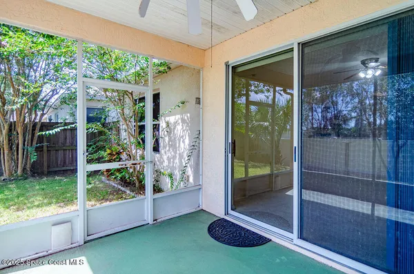 a view of backyard with a garden and deck