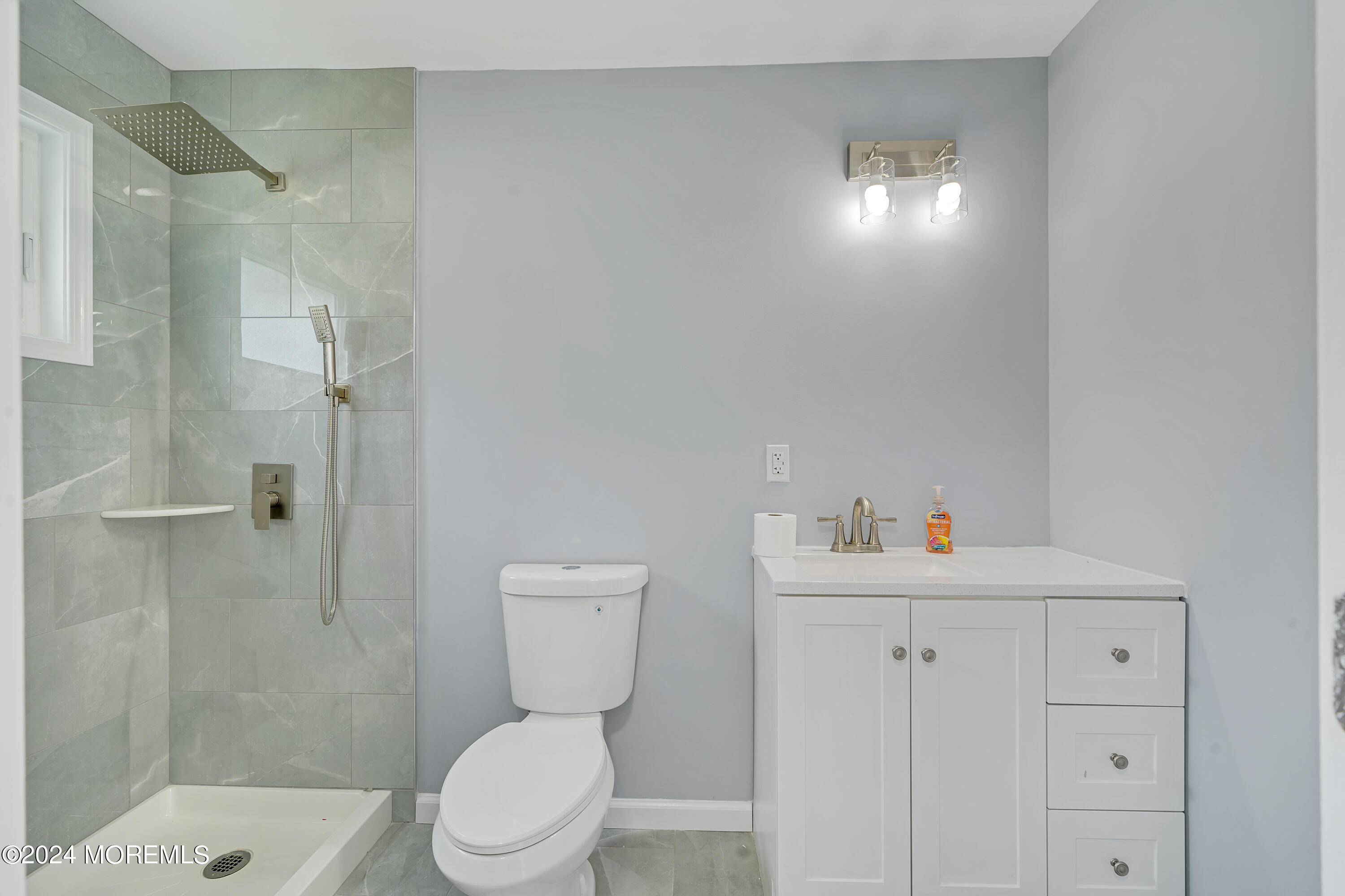 36 Pine Tree Road Old Bridge, NJ 08857 - Photo 15 of 34 a bathroom with a sink a toilet and shower