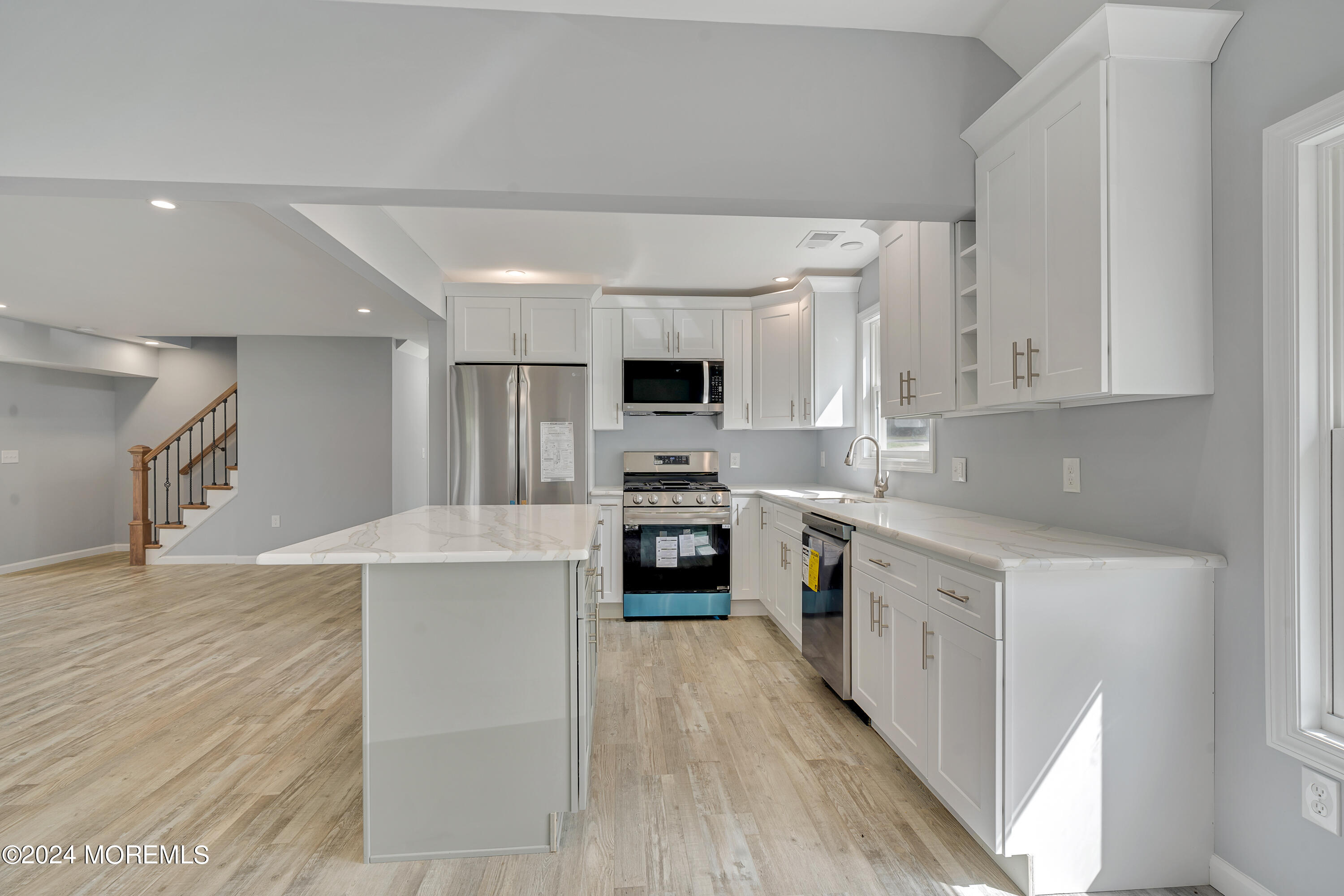 36 Pine Tree Road Old Bridge, NJ 08857 - Photo 23 of 34 a kitchen with granite countertop a stove top oven and cabinets