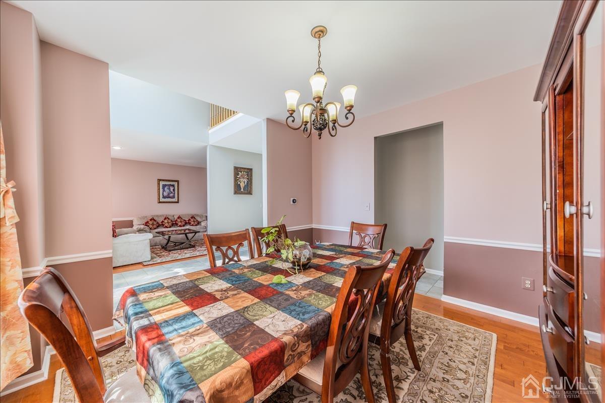 46 Potomac Road Monmouth Junction, NJ 08852 - Photo 13 of 42 a view of a dining room with furniture and chandelier