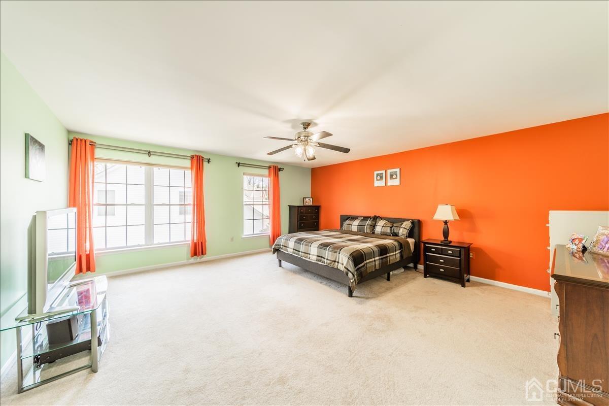 46 Potomac Road Monmouth Junction, NJ 08852 - Photo 22 of 42 a spacious bedroom with a bed and a couch