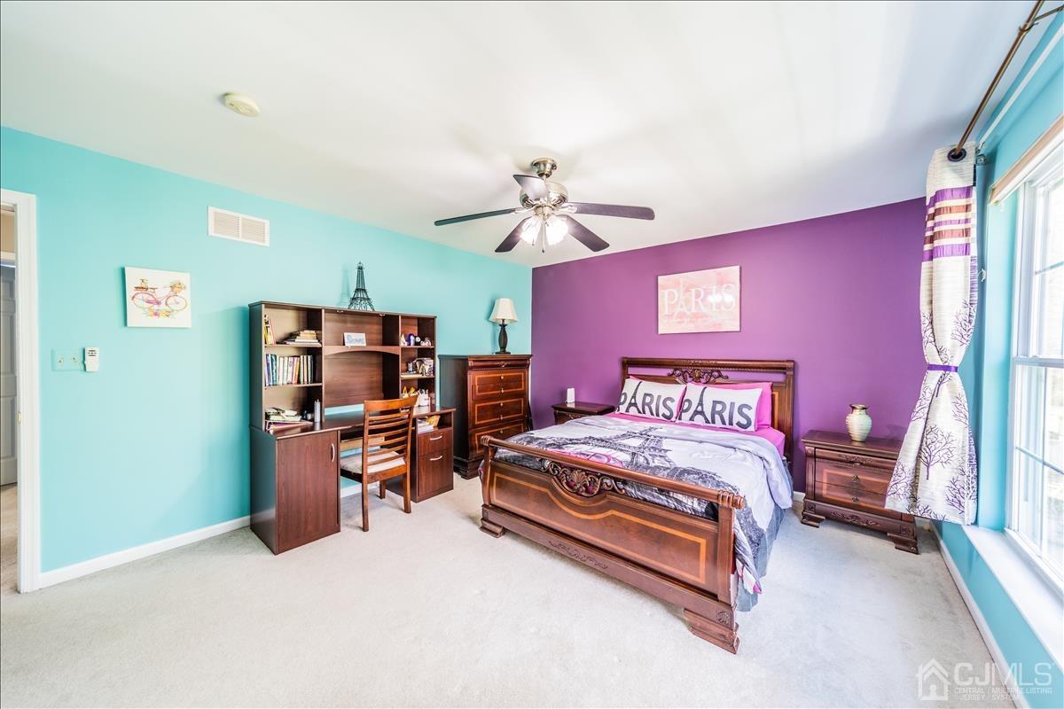 46 Potomac Road Monmouth Junction, NJ 08852 - Photo 28 of 42 a bedroom with a bed and a flat screen tv