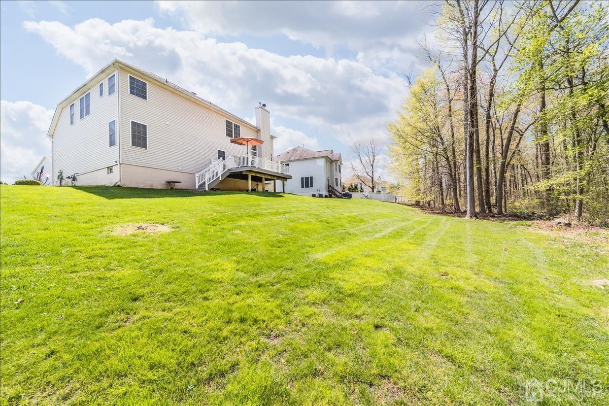 46 Potomac Road Monmouth Junction, NJ 08852 - Photo 41 of 42 a view of a house with a yard and garage