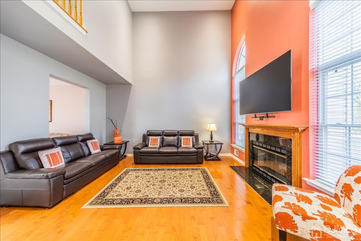 46 Potomac Road Monmouth Junction, NJ 08852 - Photo 8 of 42 a living room with furniture and a flat screen tv