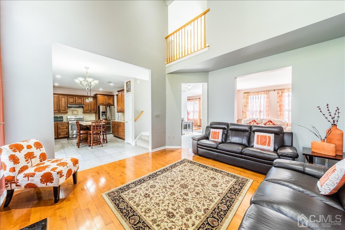 46 Potomac Road Monmouth Junction, NJ 08852 - Photo 10 of 42 a living room with furniture and a rug