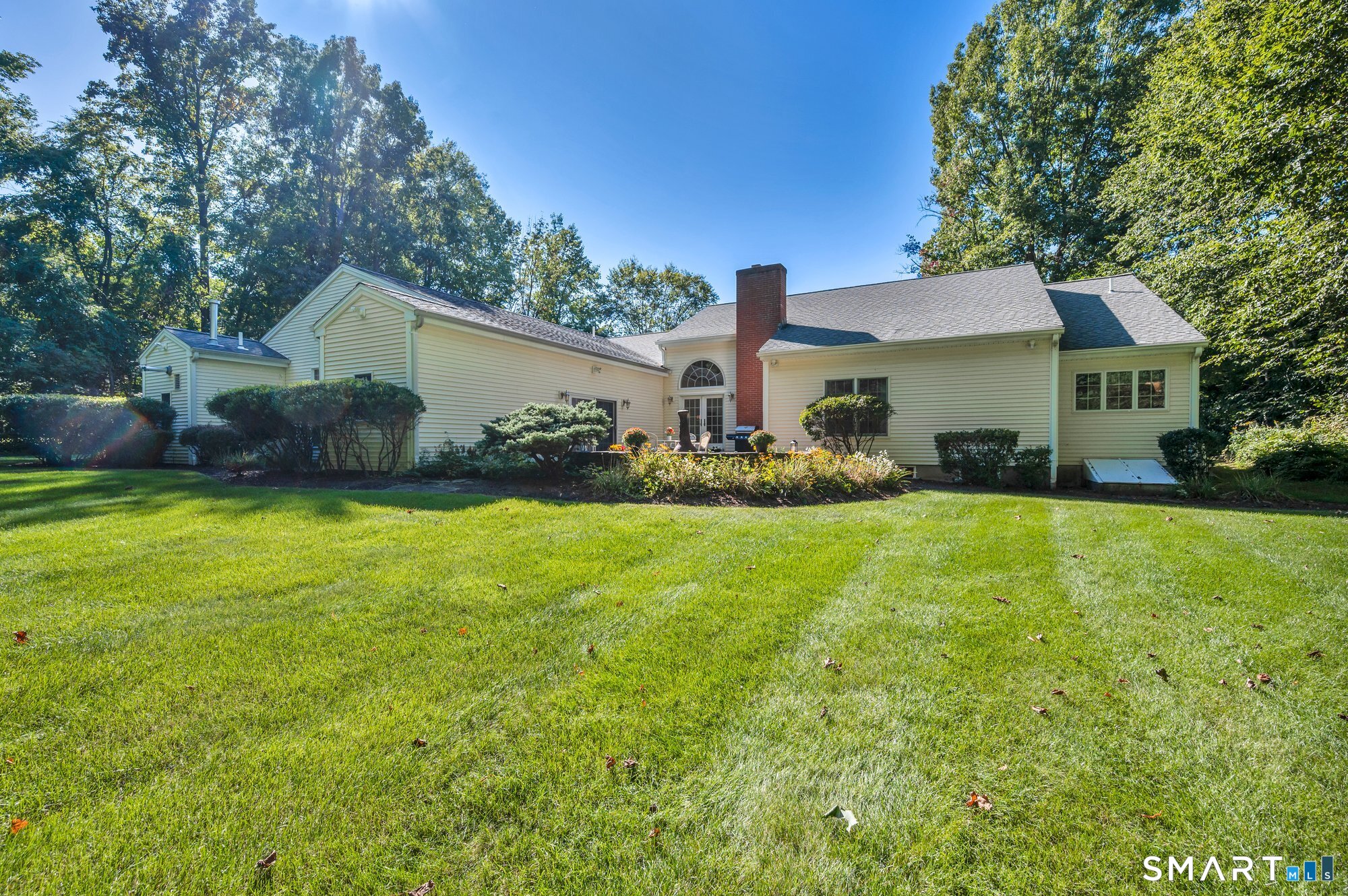 270 Copper Ridge Southington, CT 06489 - Photo 5 of 40 Lovely yard, with curved stone wall and paver patio create the perfect sanctuary.
