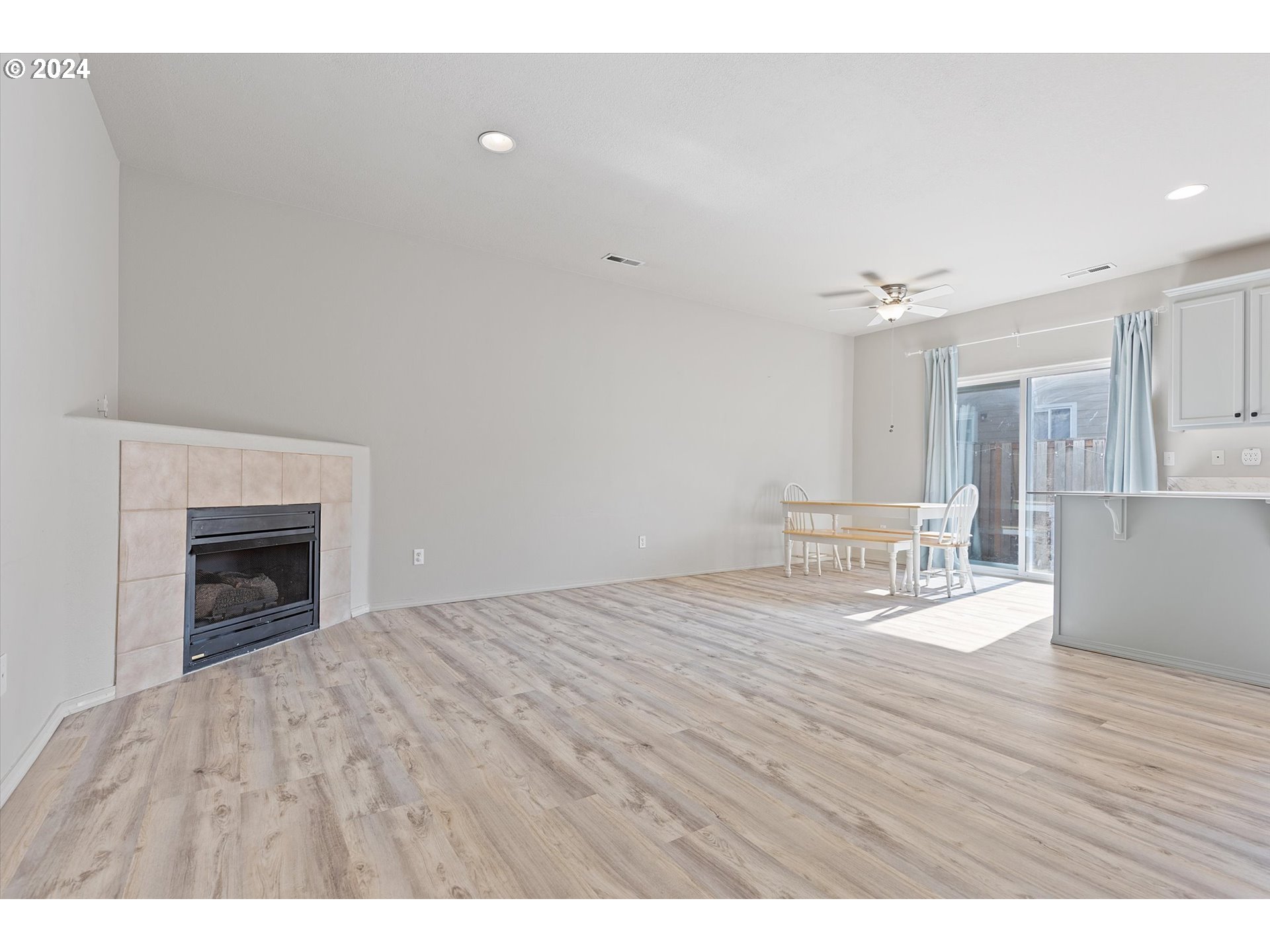 3181 Southwest 177th Place Beaverton, OR 97003 - Photo 11 of 31 a view of empty room with wooden floor and fireplace