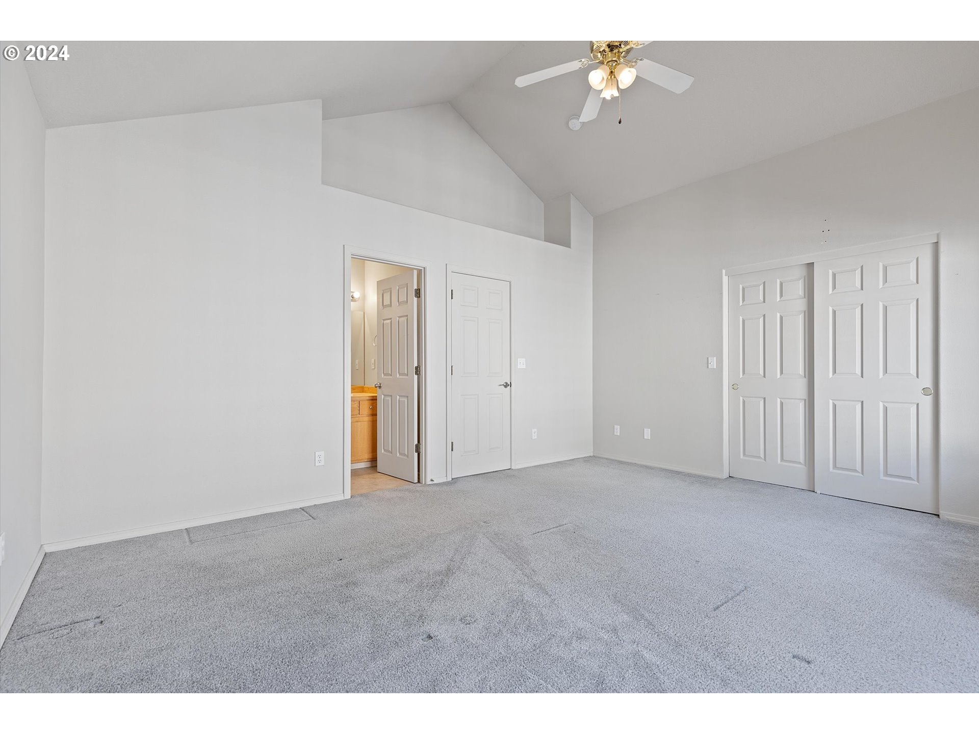 3181 Southwest 177th Place Beaverton, OR 97003 - Photo 18 of 31 a view of an empty room with a ceiling fan