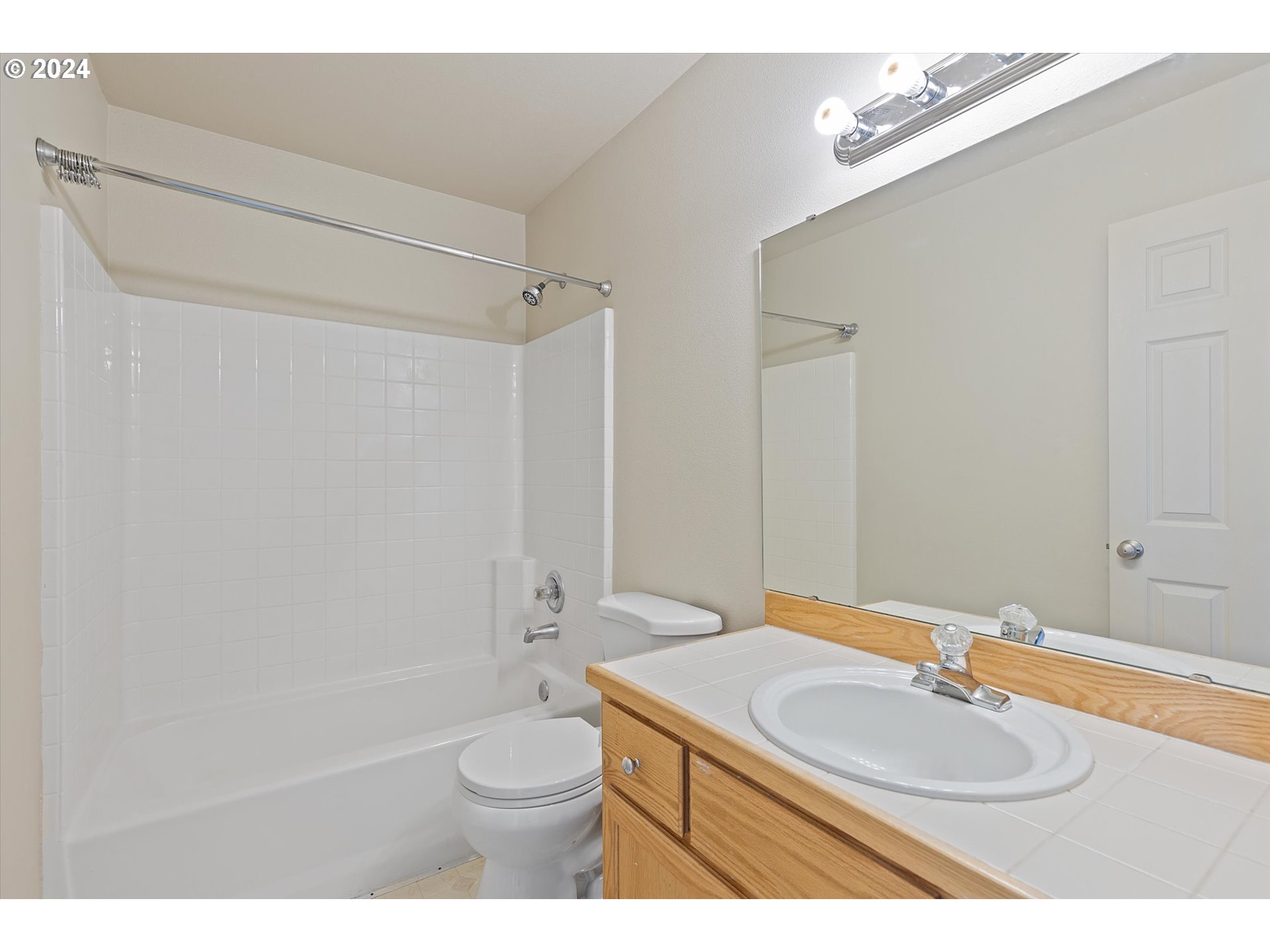 3181 Southwest 177th Place Beaverton, OR 97003 - Photo 24 of 31 a bathroom with a granite countertop sink toilet a mirror and shower