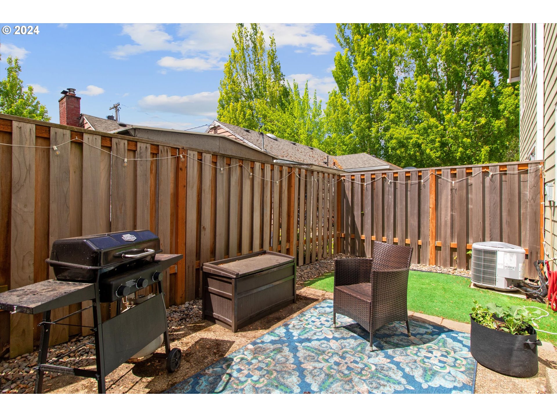 3181 Southwest 177th Place Beaverton, OR 97003 - Photo 29 of 31 a backyard of a house with chairs and a yard
