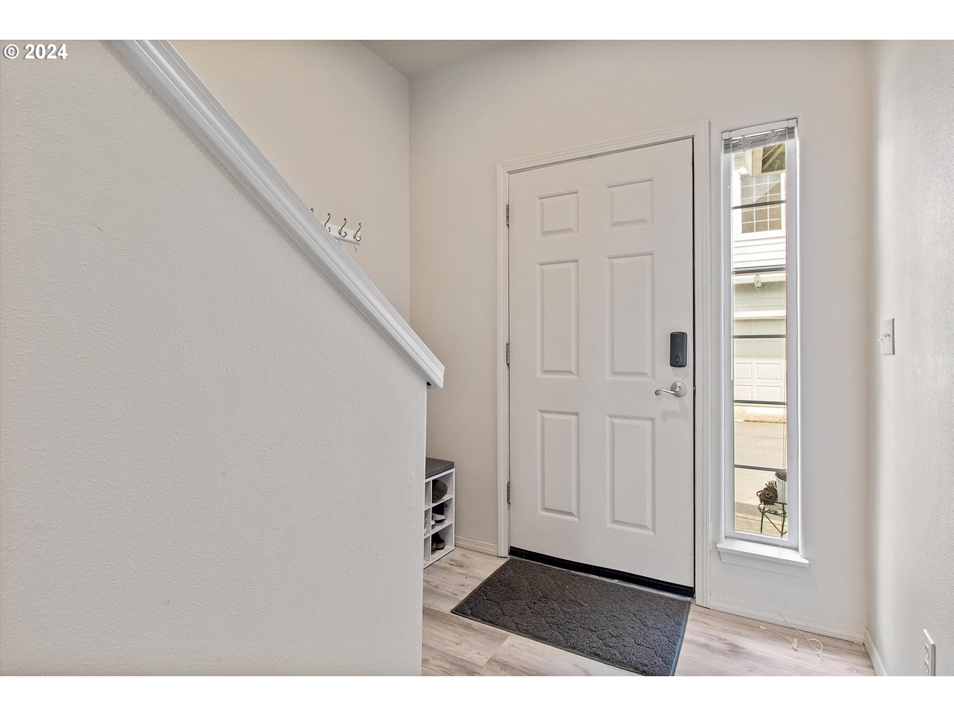 3181 Southwest 177th Place Beaverton, OR 97003 - Photo 3 of 31 a view of an entryway with wooden floor