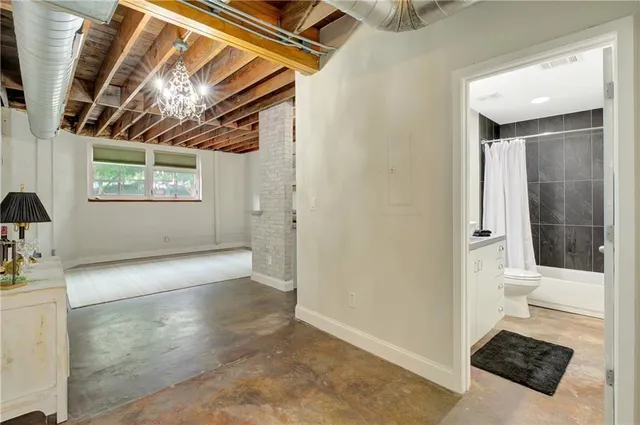 a view of empty room with window and front door