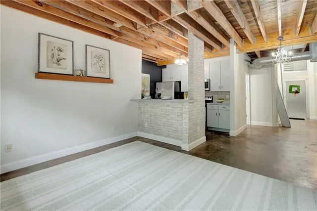 a view of a livingroom with wooden floor