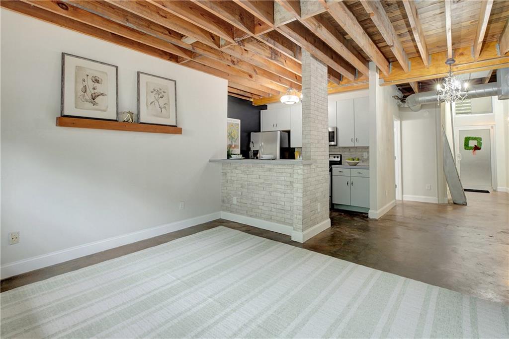 172 Carroll Street Southeast, Unit 103 Atlanta, GA 30312 - Photo 4 of 23 a view of a livingroom with wooden floor