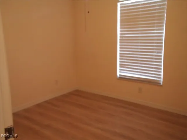 a view of a room that has a window in it