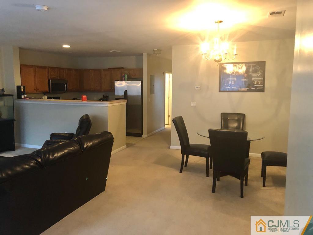 368 Rector Street, Unit 404 Perth Amboy, NJ 08861 - Photo 11 of 11 a living room with furniture and a piano