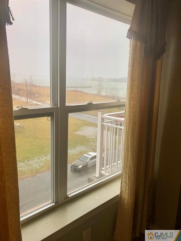 368 Rector Street, Unit 404 Perth Amboy, NJ 08861 - Photo 6 of 11 a view of a glass door and a window