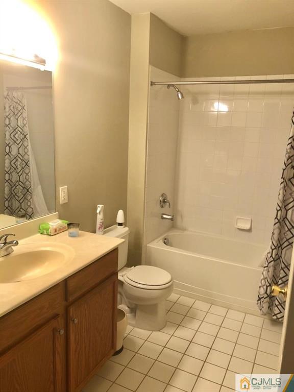 368 Rector Street, Unit 404 Perth Amboy, NJ 08861 - Photo 7 of 11 a bathroom with a sink a toilet and shower