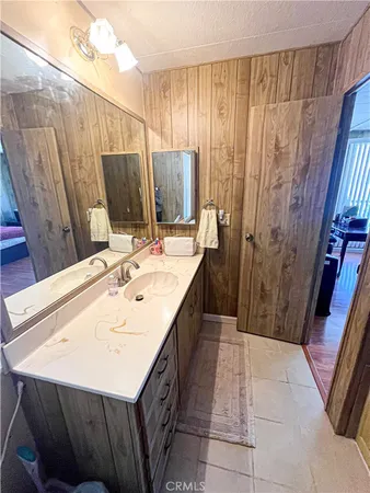 a bathroom with a sink a mirror and a shower