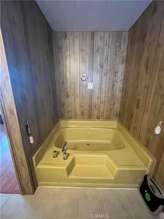 a bathroom with a tub and shower curtain