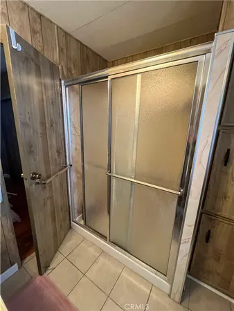 a bathroom with a glass door shower