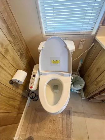 a bathroom with a toilet and a sink
