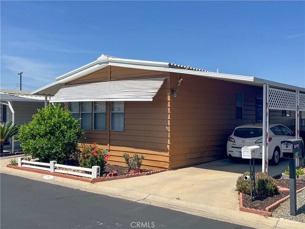 3500 Buchanan Street, Unit 24 Riverside, CA 92503 - Photo 28 of 28 a front view of a house with garage