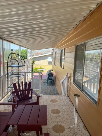 a view of a patio with a table and chairs