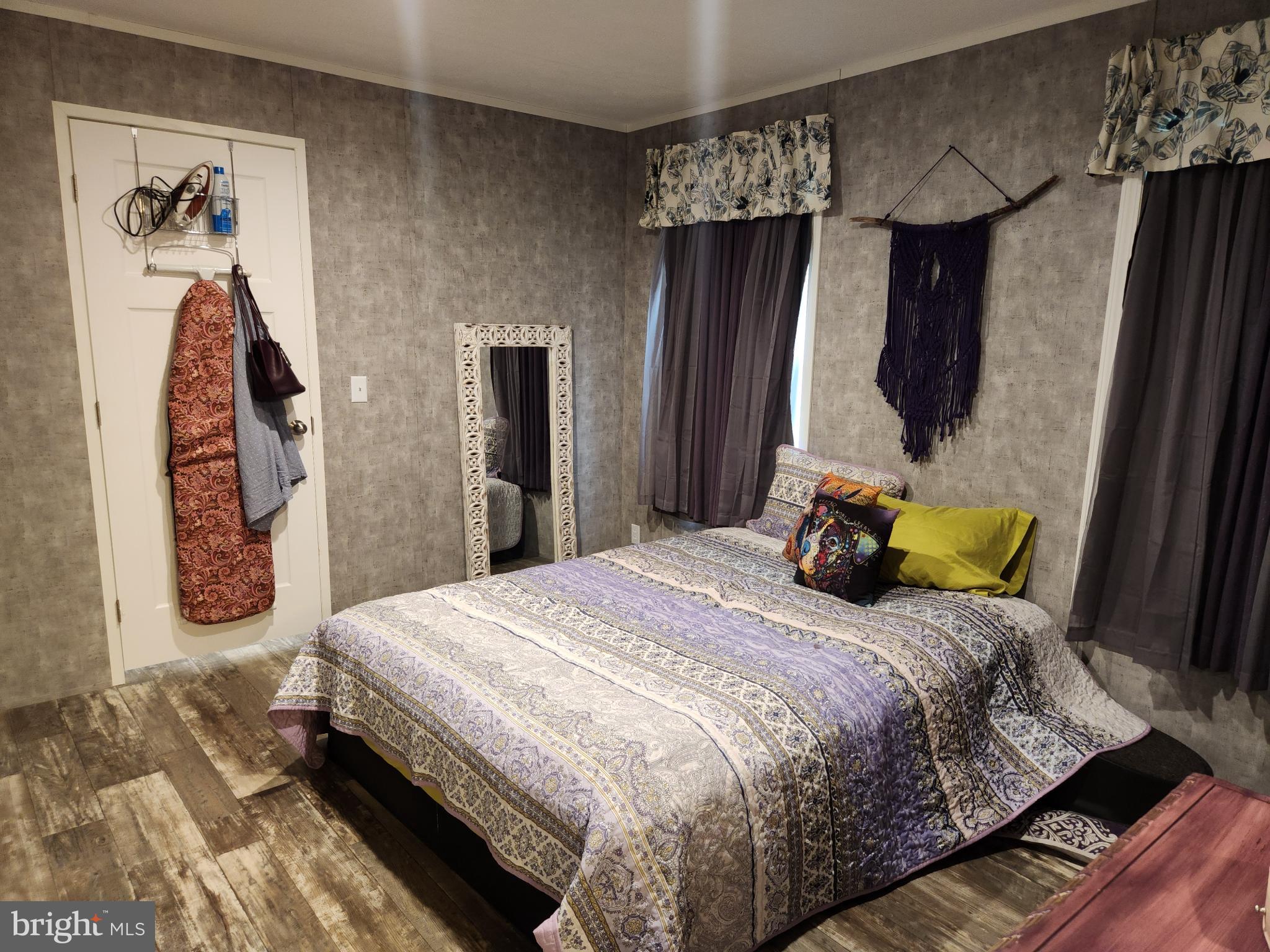 16 Mill Street York, PA 17406 - Photo 14 of 29 a bedroom with a bed and a large mirror on the dresser