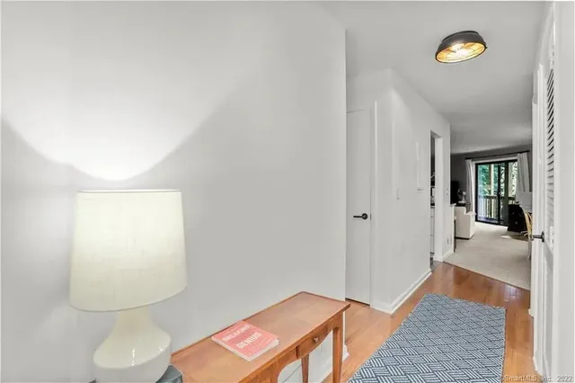view of a room with wooden floor and bathroom