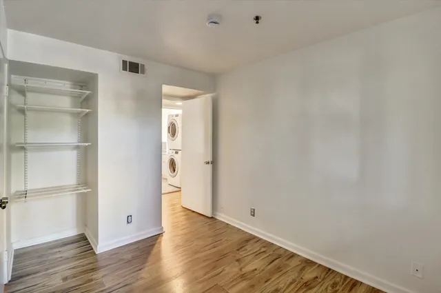 a kitchen with a refrigerator and window