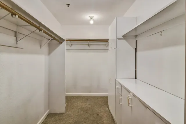 a view of a storage & utility room with closet