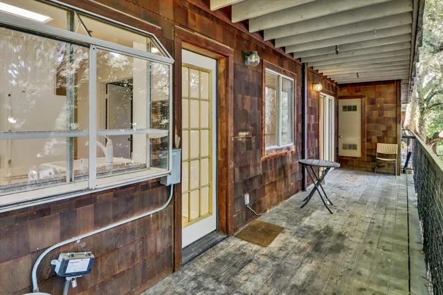 a view of balcony with wooden floor