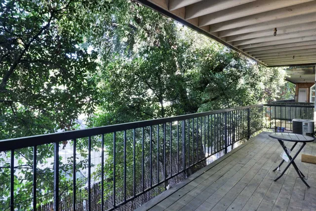 an empty room with wooden floor and closet