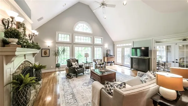 a kitchen with granite countertop a sink a center island and stainless steel appliances