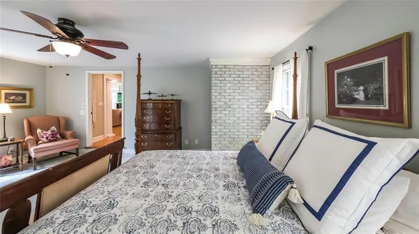 a room with a bed and a chandelier