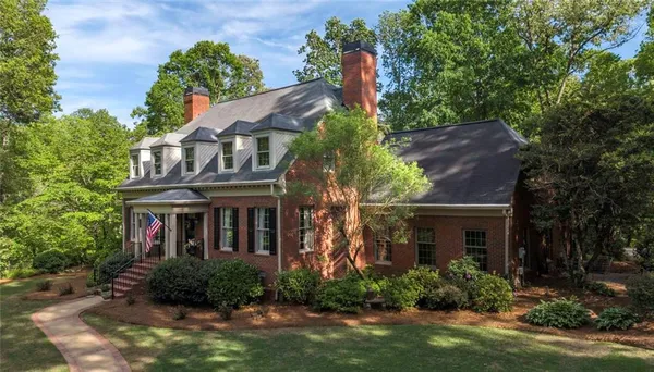 a front view of a house with a garage