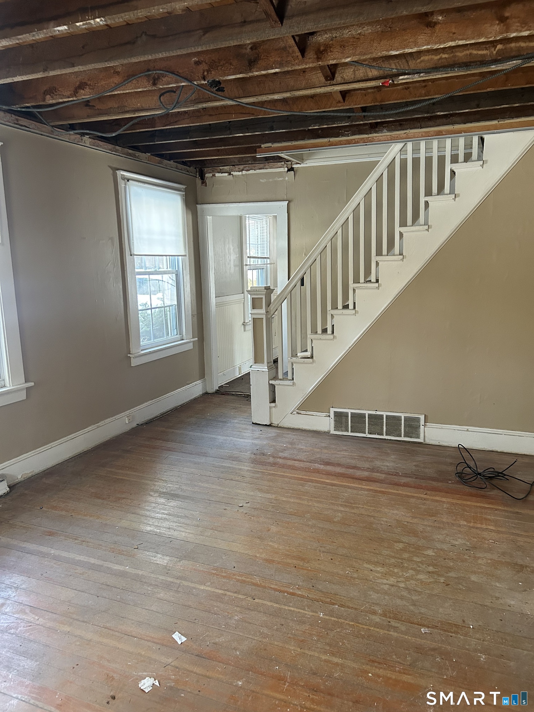 69 Munson Road Wolcott, CT 06716 - Photo 9 of 20 a view of entryway and hall with wooden floor